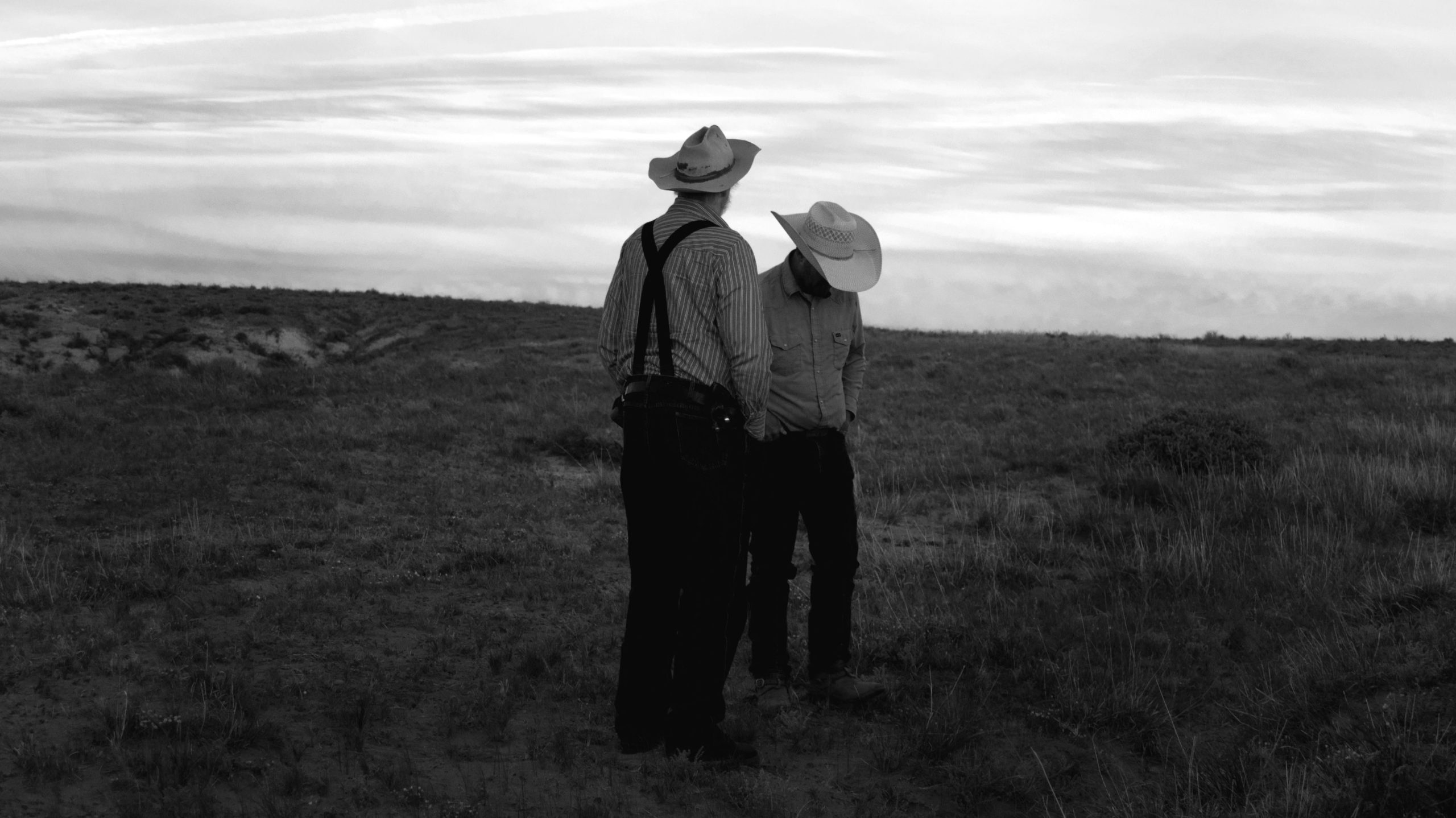 Two old cowboys standing and talking where the ordinary becomes iconic